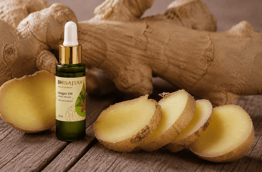 Bhisajyam Ginger Oil bottle with fresh ginger roots and sliced ginger on a rustic wooden background