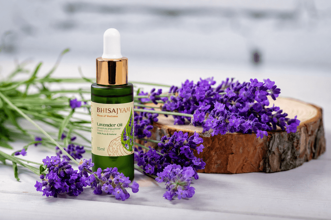 Bhisajyam Lavender Oil bottle placed among fresh lavender flowers on a wooden surface with a calming natural wellness aesthetic.