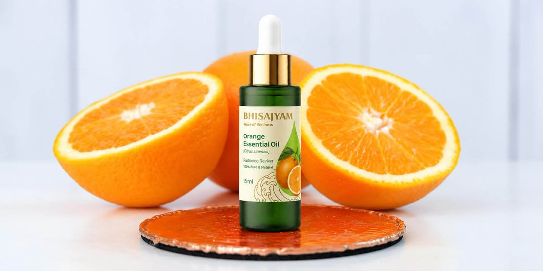 Bhisajyam Orange Essential Oil 15ml bottle with fresh orange halves for skincare use