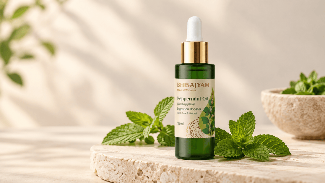 Bhisajyam Peppermint Essential Oil bottle with fresh mint leaves on a warm cream background.
